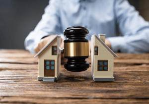 real estate lawyer dividing house with gavel