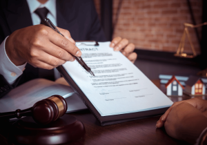 employment lawyer signing employment contract with client lawyer in london ontario helping client navigate employment law issues